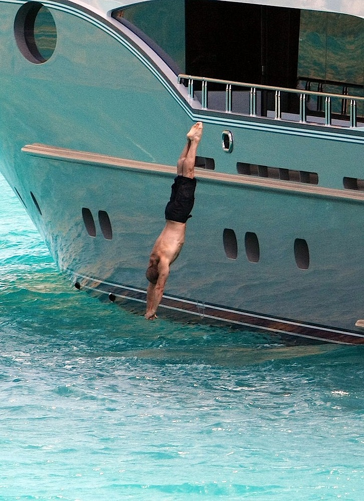 Jason Statham caught sunbathing shirtless