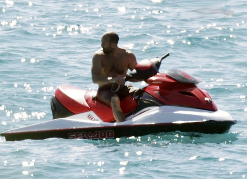 Jason Statham caught sunbathing shirtless