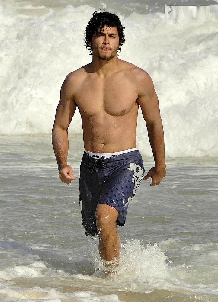 Jesus Luz shirtless on the beach in Ipanema