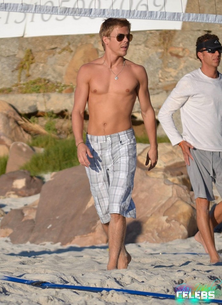 Derek Hough sunbathes shirtless
