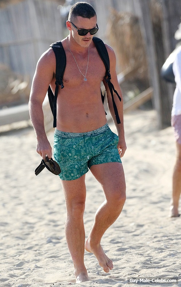 Luke Evans Tanning Shirtless On The Beach